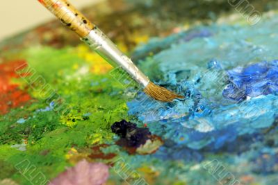 big paintbrush is mixing colors
