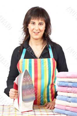Housewife close to towels stacked