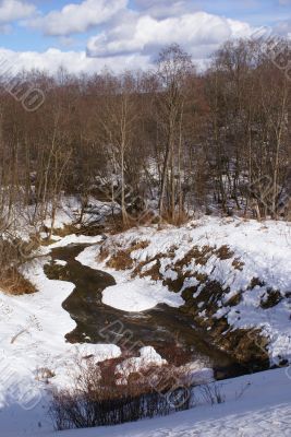 Winter river in a gully