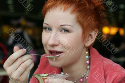 woman dreanking coffe in cafe and thoughtfully looks afar