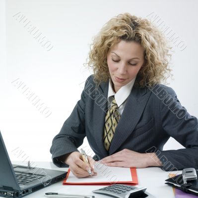 Businesswoman writing