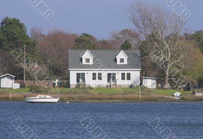 Seaside House and Sailboat