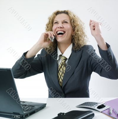 Woman laughing at phone