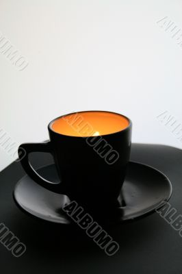 Black cup with orange light