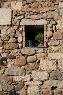 Old stone wall with square window