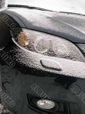 The black automobile in snow