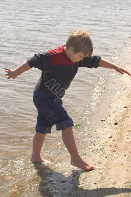 Boy Playing at the Ocean