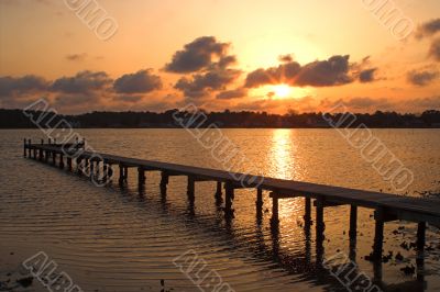 Sunrise or Sunset over a Pier