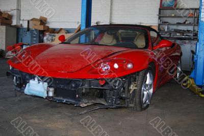 Dusty Damage red Sportscar