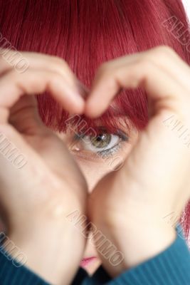 woman shows heart