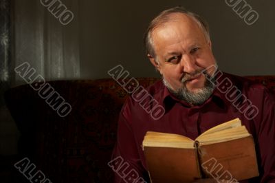 Wise man behind reading by the book