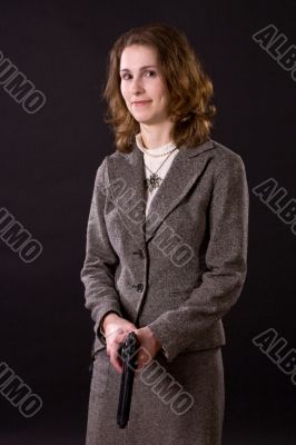 smiling businesswoman wtith gun