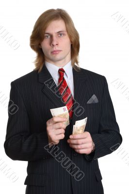 a businessman in a suit considering money