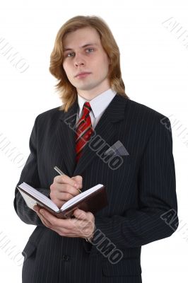 a businessman in a suit with a notebook