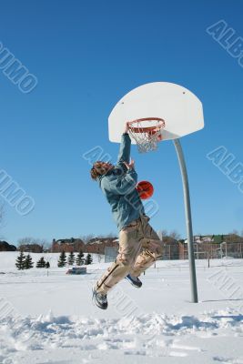  young man playing basketball