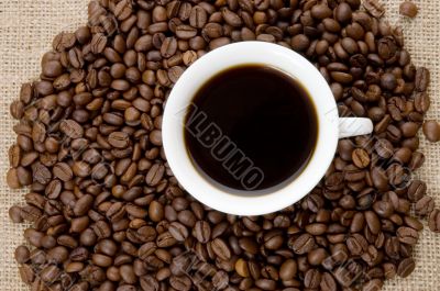 Coffee beans and cup