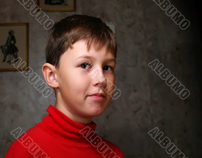 Smiling boy in dark room