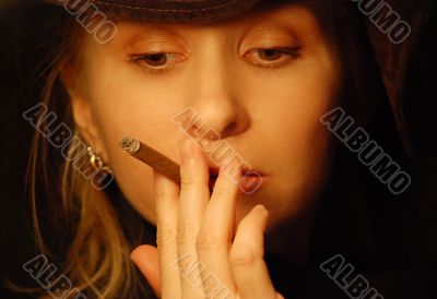 attractive young woman with cigar