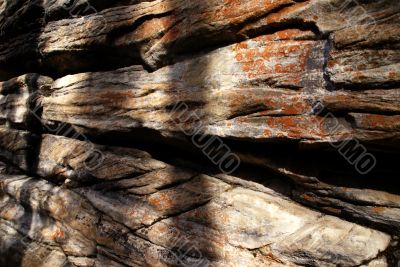 Colorful eroded limestone cliff layers