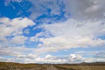 Lonely road under cloudy sky