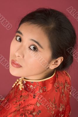Chinese girl in red cheongsam