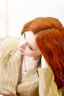 Attractive redhead woman in classic suit