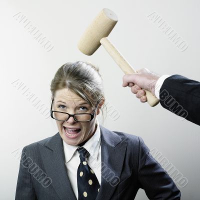Executive being hammered