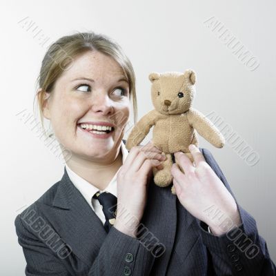 Woman playing with teddy