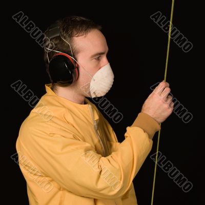 Man Reading A Tapemeasure