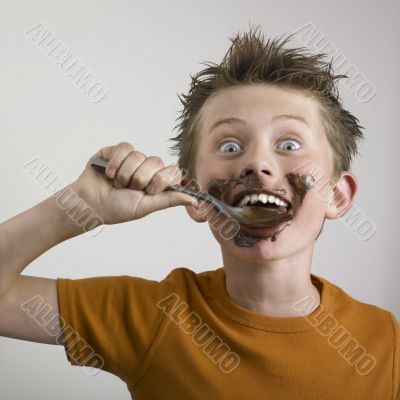 Boy eating chocolate