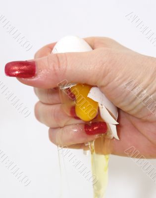 The female hand presses an egg on the night of February, 29th