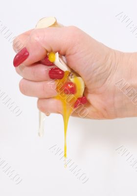 The female hand presses an egg on the night of February, 29th