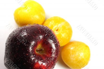 Apple and yellow plums