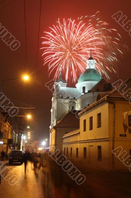 Celebratory fireworks behind a Catholic church