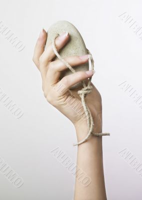 Female hand and pumice stone