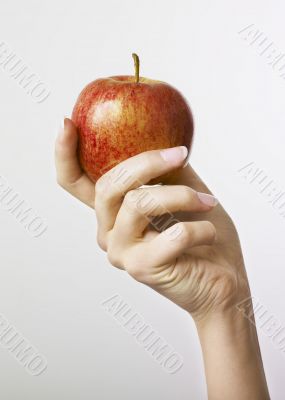 Hand and apple