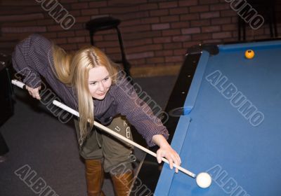 beautiful girl playing pool
