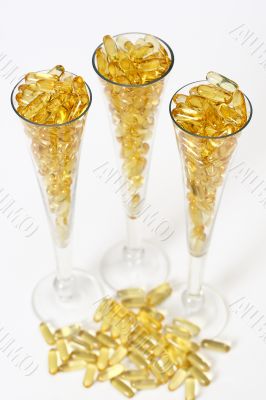 Three glasses with gold boluses