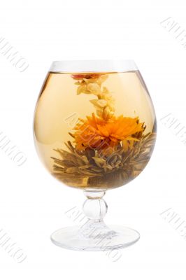 Glass with a flower green tea