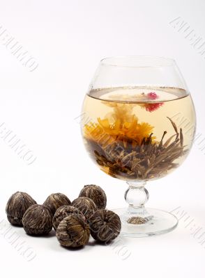 Glass with a flower green tea