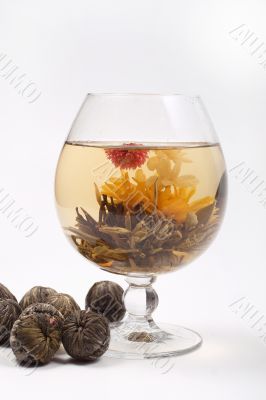 Glass with a flower green tea
