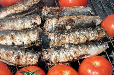 smoking grilled sardines on the barbeque
