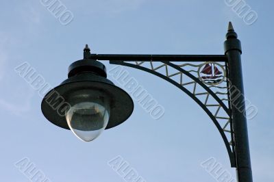 Ornate Street Light Against Blue Sky