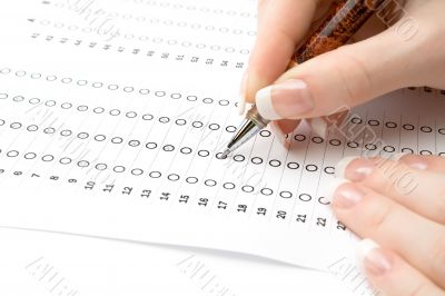 Woman filling the exam test sheet