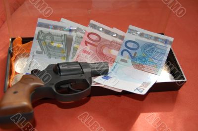 the pistol and money