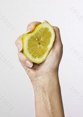 Hand holding lemon