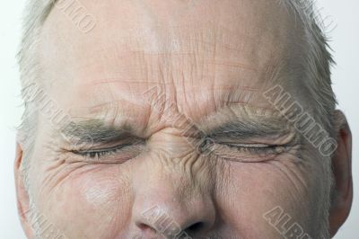 Man With Eyes Tightly Shut