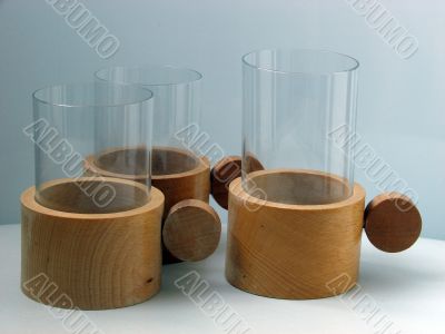 Three glass glasses in supports