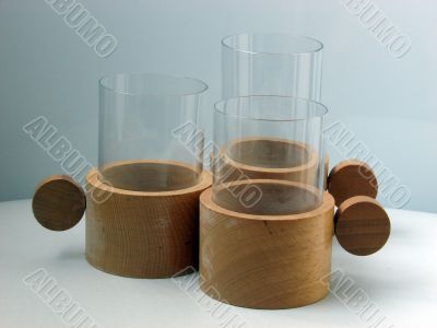 Three glass glasses in supports