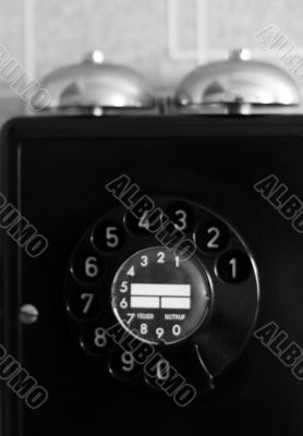 black retro telephone on white